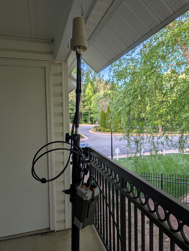 Yogurt cup antenna on second story balcony